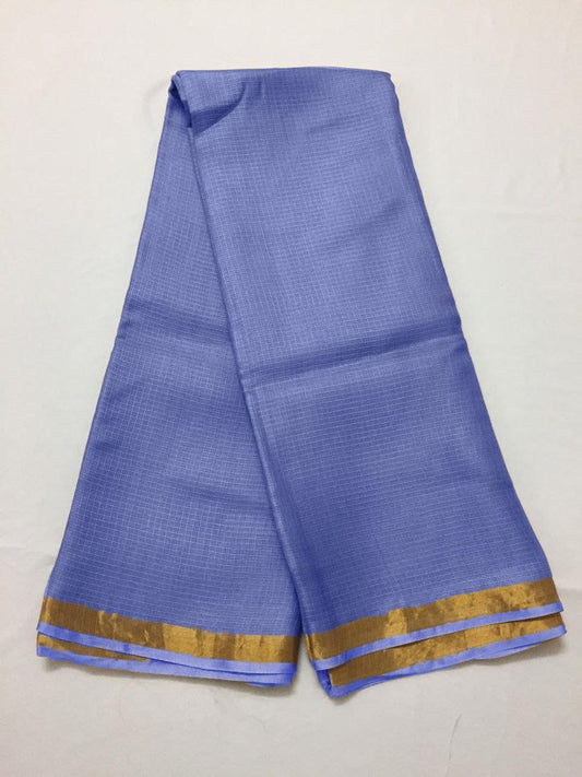 Blue saree with a gold border on a white background