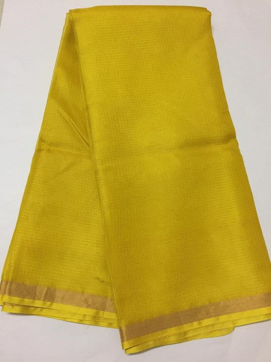 Yellow fabric with a subtle pattern on a white background