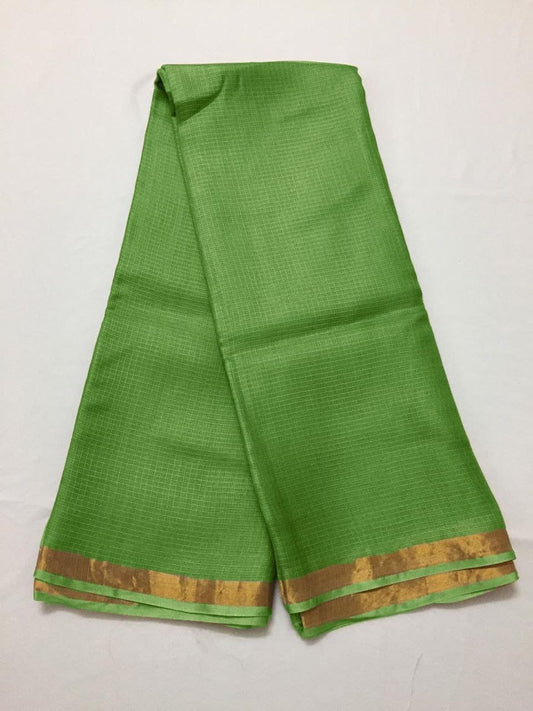 Green kota silk saree with a gold border