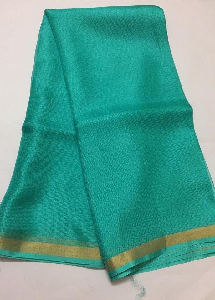 Sea Green kota silk saree with a gold border