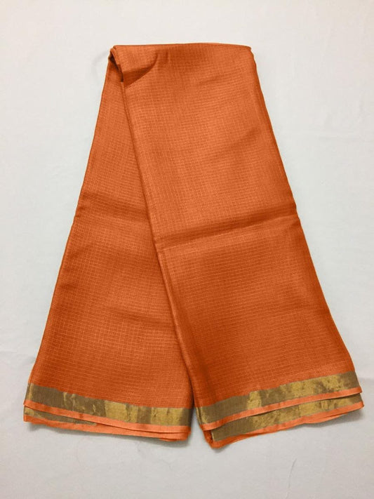 Orange kota silk saree with a gold border