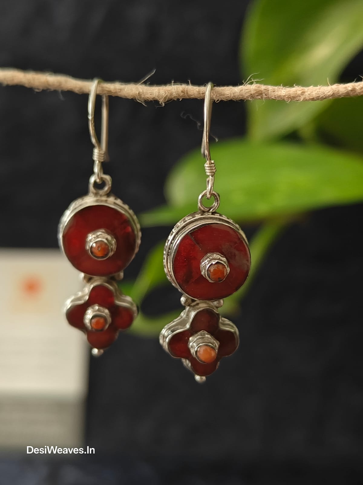Pair of red and silver earrings