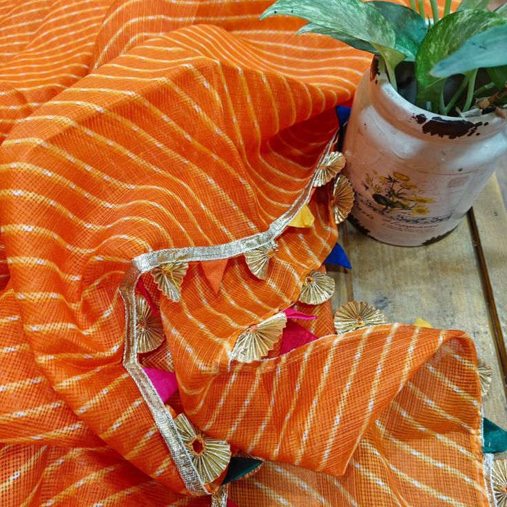 Orange dupatta with gold embroidery