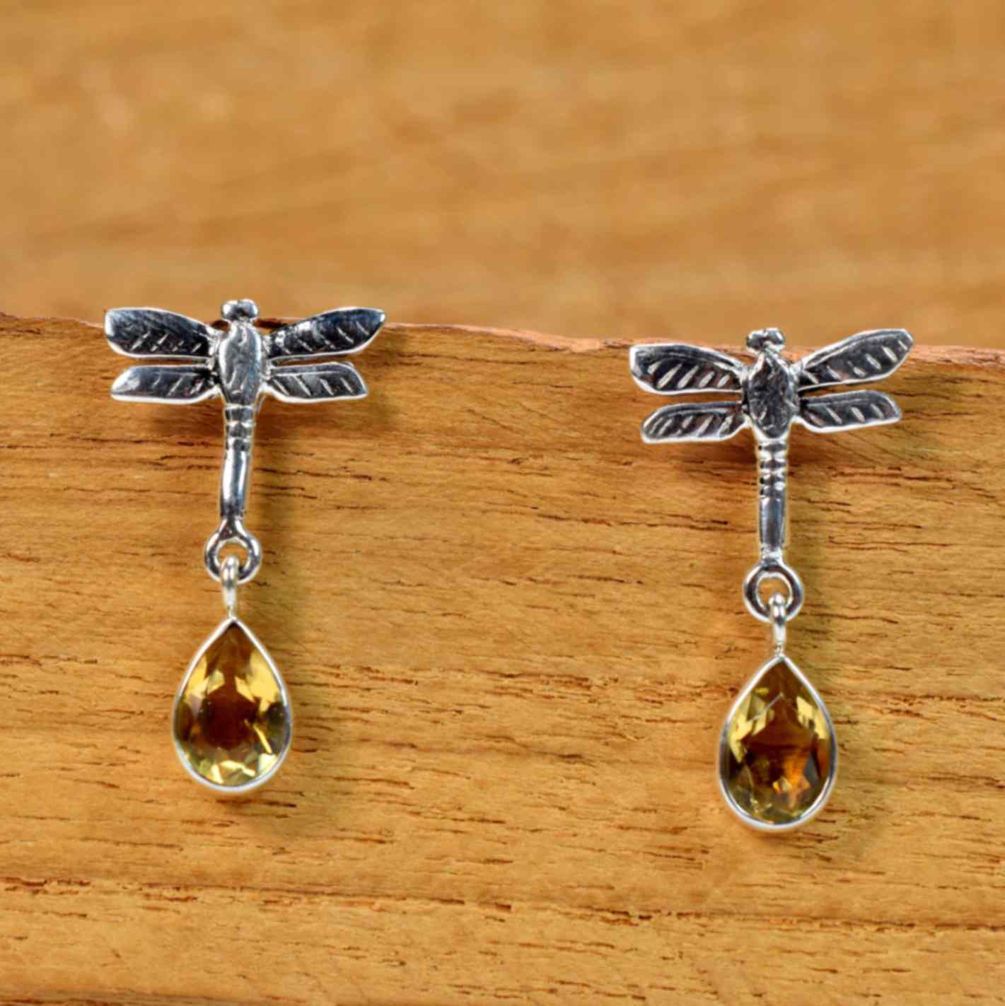Dragonfly-shaped earrings with amber drops