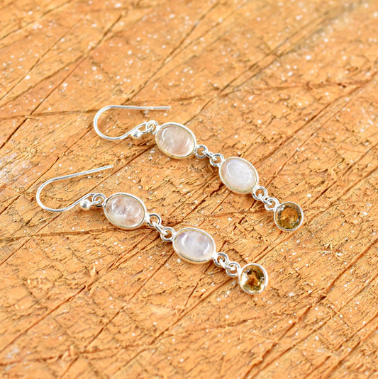 Silver earrings with gemstones.