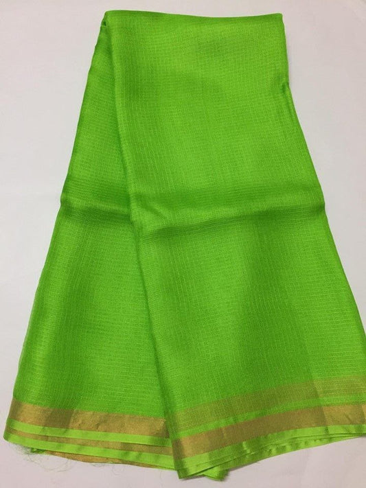 Green kota silk saree with a gold border 