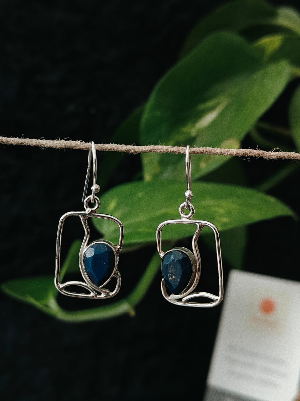 Pair of silver earrings with blue stones 