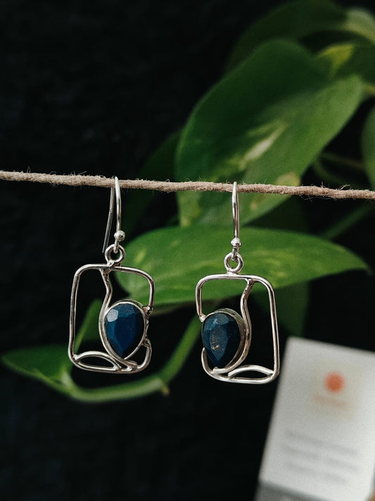 Pair of silver earrings with blue stones 