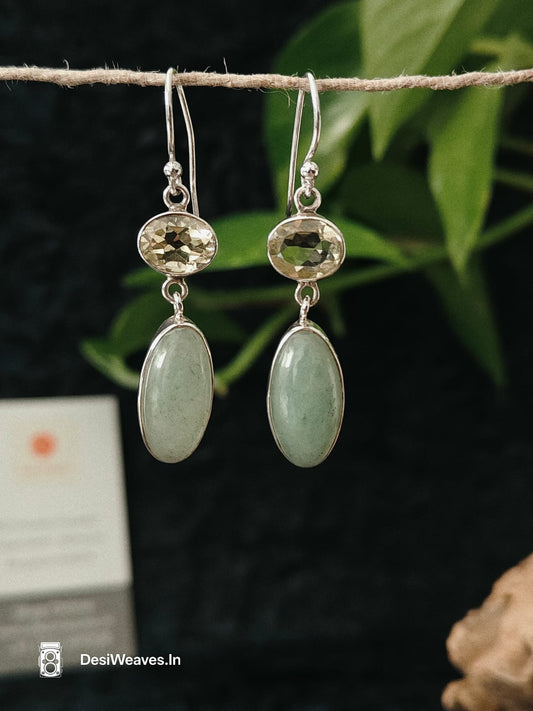 Pair of silver earrings with green stones