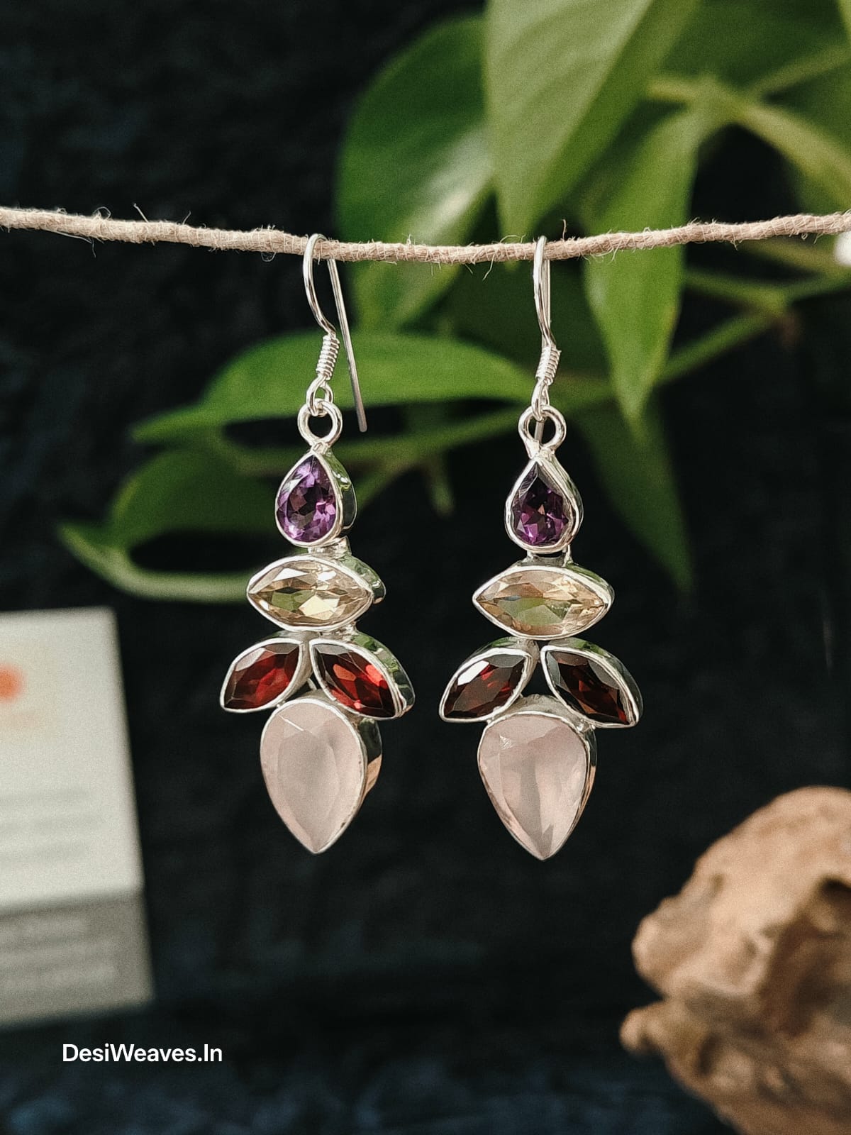 Pair of silver earrings with multicolored gemstones