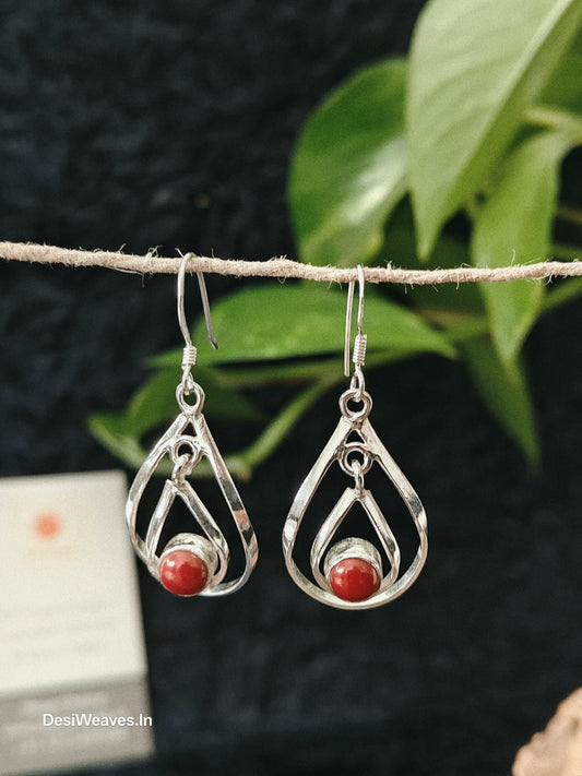 Silver earrings with red stones