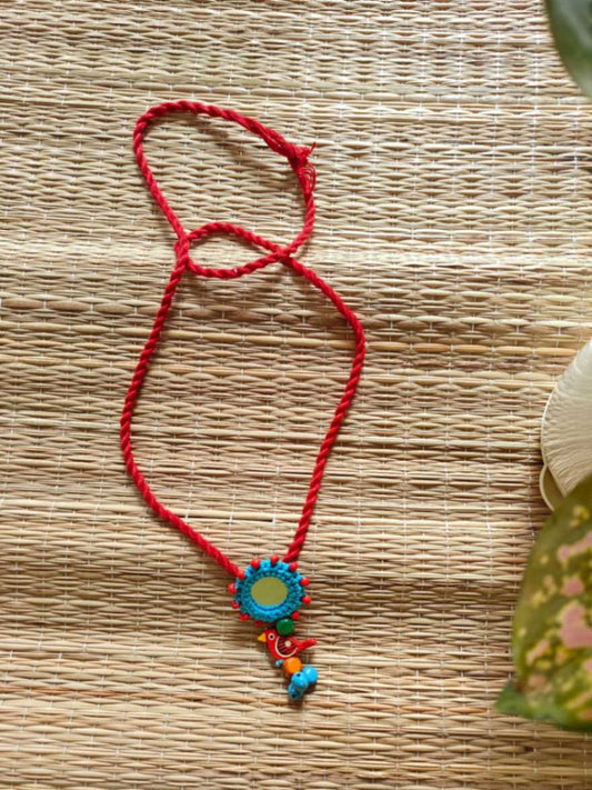 Colorful necklace with a decorative pendant