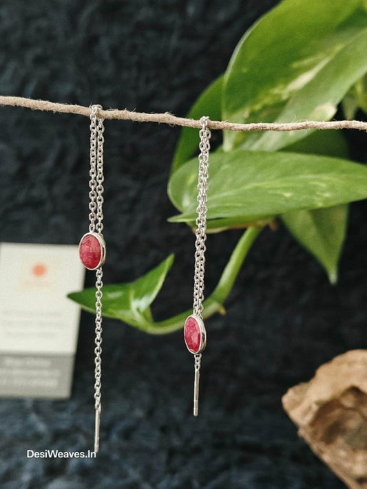 Silver earrings with red stones.