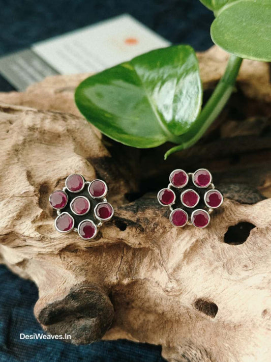 Pair of earrings with red stones